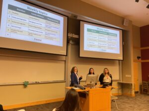 Three women give a presentation