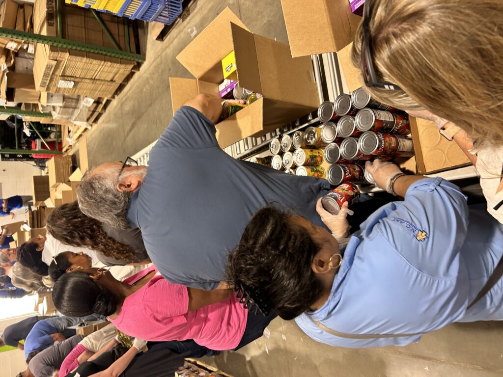 team packing food boxes at the foodbank