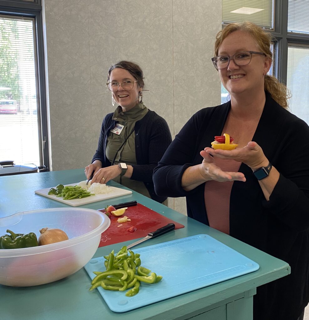 staff cutting peppers