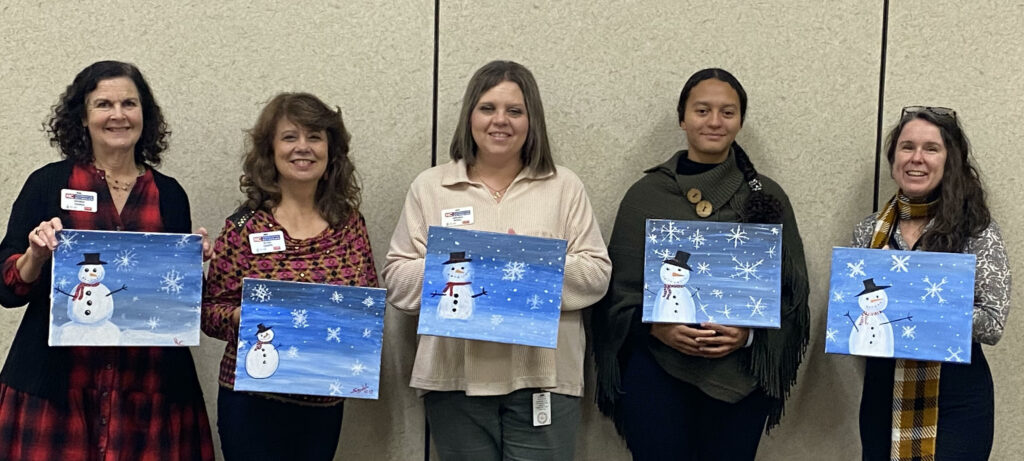 staff with snowman paintings