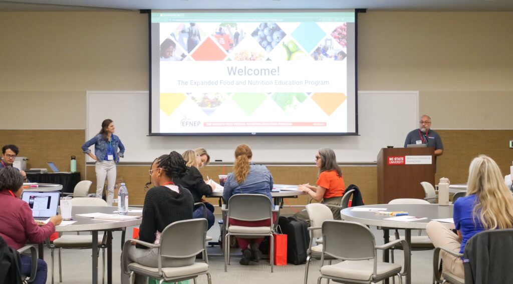 EFNEP educators sitting at tables during food recall training