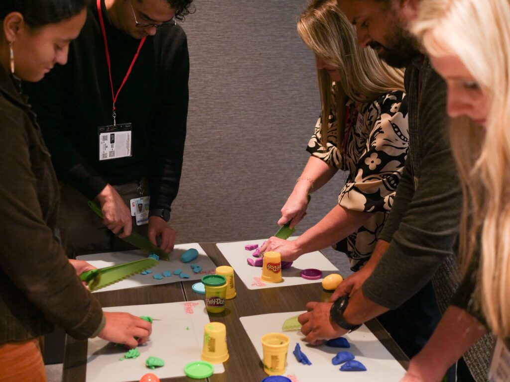 EFNEP staff practicing knife skills activity using play-dough